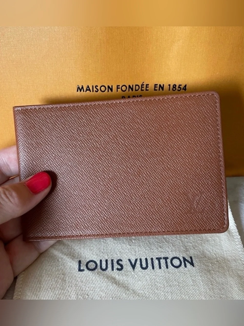 LOUIS VUITTON brown multiple bifold wallet in durable Taiga cross-grain leather